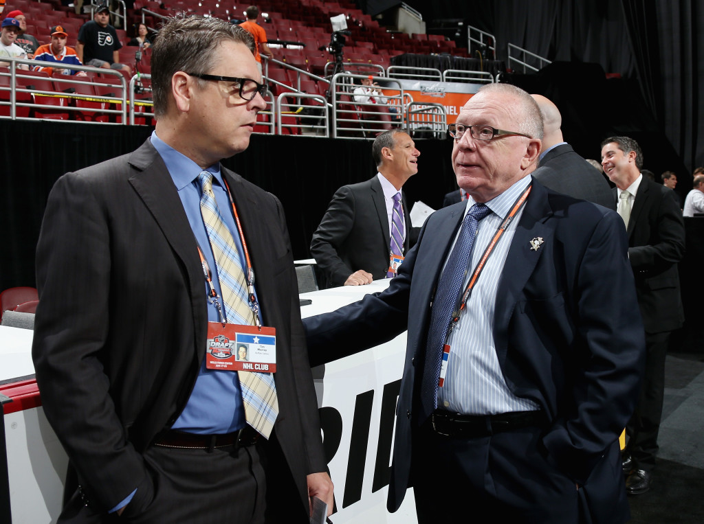 PHILADELPHIA, PA - JUNE 28: Tim Murray, General Manager of the Buffalo Sabres speaks with Jim Rutherford, General Manager of the Pittsburg Penguins on Day Two of the 2014 NHL Draft at the Wells Fargo Center on June 28, 2014 in Philadelphia, Pennsylvania.  (Photo by Bruce Bennett/Getty Images)